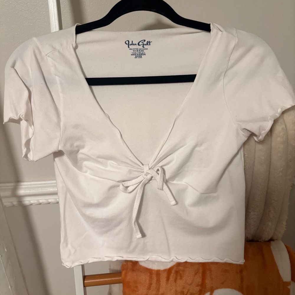 John Galt white top